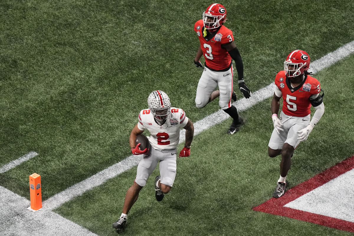 Ohio State wide receiver Emeka Egbuka runs into the end zone for a touchdown against Georgia.